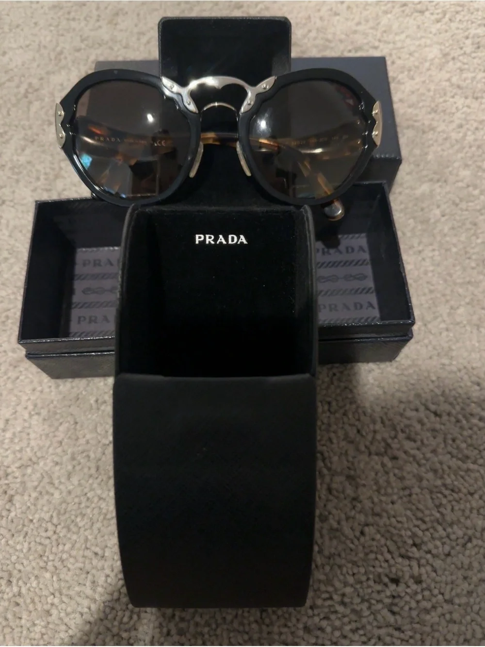 Prada Black Round Sunglasses with Brown-Tinted Lenses